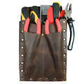The 2-Pocket Tool Bag by Hide & Drink filled with various tools, showcasing its practical design and functionality. Made from thick full grain leather, this artisan-crafted organizing bag exemplifies hand cut and hand sewn techniques. Supporting small batch production, it is made by talented artisans in La Antigua Guatemala & Oaxaca Mexico, perfect as a multitool holder for work essentials.