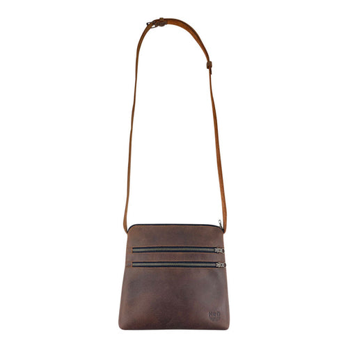 Front view of the 3 Zipper Satchel by Hide & Drink, showcasing its handmade design from durable full grain leather and plaid cotton. This versatile handbag features twin zippered pockets and is perfect for everyday use. 3 Zipper Satchel - Versatile Handbag, Handmade from Full Grain Leather and Plaid Cotton, Small Batch Production, Hand Cut, Hand Sewn, Fire Branded, Artisan, Handmade in La Antigua Guatemala & Oaxaca Mexico.