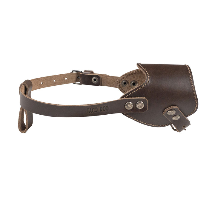 Close-up view of the Adjustable Dog Muzzle by Taco Dog, highlighting its durable full grain leather construction and adjustable strap for a custom fit. This beautiful muzzle is handmade in La Antigua Guatemala, ensuring unique artisan quality for your pet.