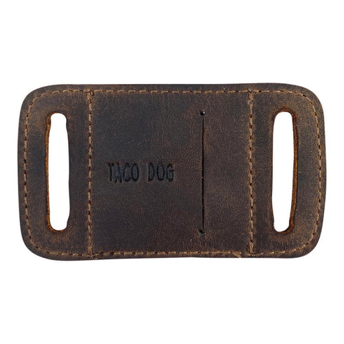Reverse side of the Rustic AirTag Sleeve for Dog Collar 1.25" Wide by Taco Dog, featuring the brand name. This durable accessory easily slides onto collars, made from full grain leather to prevent loss and accidents with effective tracking, hand crafted in La Antigua Guatemala.