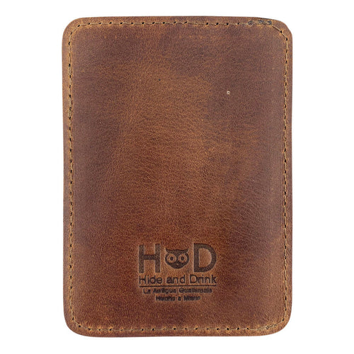 Back view of the AirTag Vertical Card Holder from Hide & Drink, highlighting the rustic charm of Full Grain Leather. This artisan product is handmade in La Antigua Guatemala & Oaxaca Mexico, reflecting small batch production, and impeccable attention to detail through hand cut and hand sewn techniques.