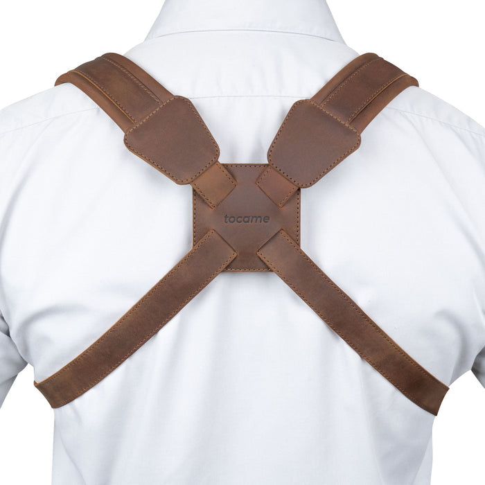 Rear view of the Ajustable Harness for Alto & Tenor Saxophone by tocame, displaying the padded back support that offers comfort during use. This full grain leather harness is essential for marching bands and is a testament to artisan skills from small batch production in La Antigua Guatemala and Oaxaca Mexico.