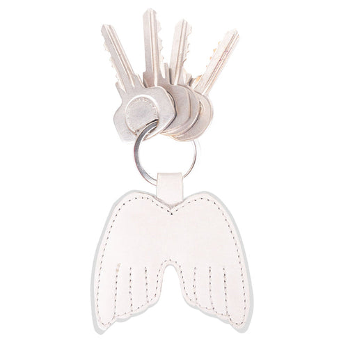 Angel Wings Keychain by Hide & Drink featuring a stylish design with keys attached, crafted from Full Grain Leather. This key ring holder embodies peace and elegance, showcasing small batch production techniques. Handmade in La Antigua Guatemala & Oaxaca Mexico, it is hand-cut, hand-sewn, and fire branded, reflecting true artisan craftsmanship.