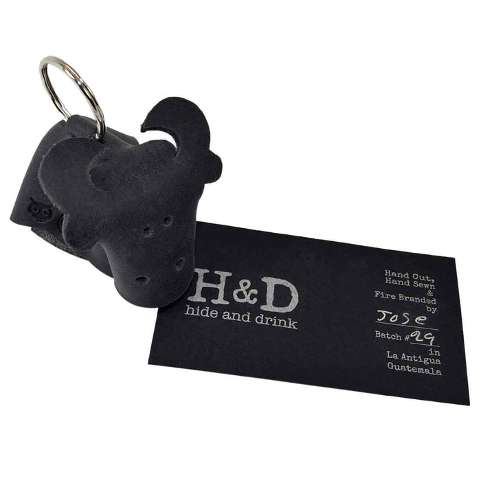 Distinctive Full Grain Leather Animal Key Chain from Hide & Drink, featuring a cow design. This Critter Keychain serves as a fun fob charm and a practical animal key holder charm pendant, crafted with attention to detail in small batches in La Antigua Guatemala.