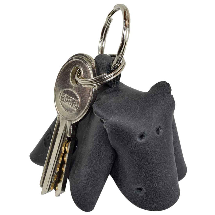 Unique Full Grain Leather Animal Key Chain by Hide & Drink highlighting a cute cow design. This Critter Keychain serves as a chic fob charm and an animal key holder charm pendant, representing high-quality small batch craftsmanship from La Antigua Guatemala.