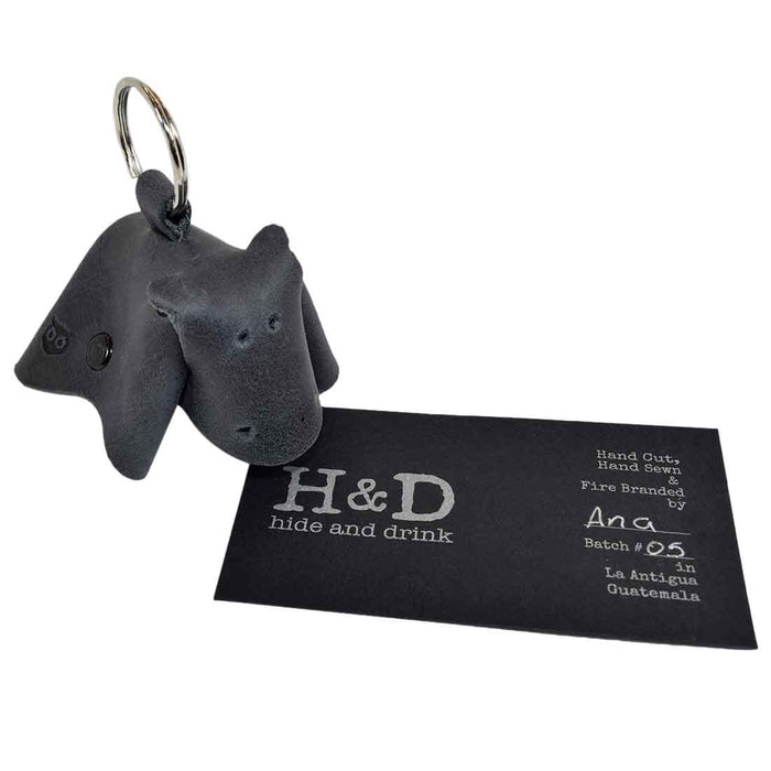 Artisan-crafted Full Grain Leather Animal Key Chain by Hide & Drink, showcasing a unique cow design. This lovely Critter Keychain serves as both a trendy fob charm and an animal key holder charm pendant, emphasizing small batch production in La Antigua Guatemala.