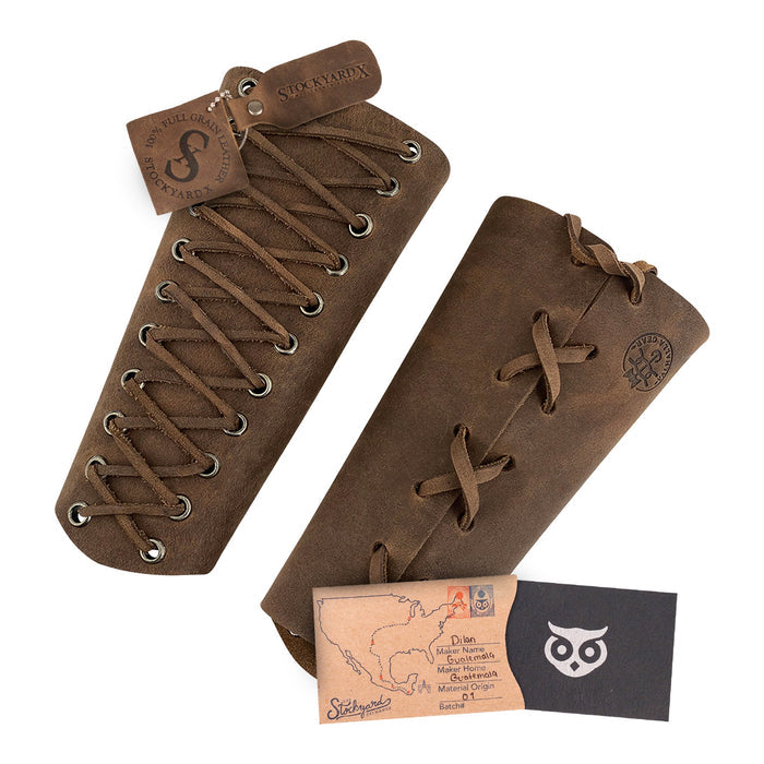 Valhalla Gear Archery Bracer - 2 pack set with packaging and branding tags alongside the bracers. The bracers made of full grain leather are a fantastic hand protector for bow shooting practice. This outdoor sports armband is a result of artisan craftsmanship with small batch production, hand cut, hand sewn, and fire branded techniques. Handmade in La Antigua Guatemala & Oaxaca Mexico.