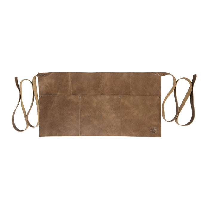 Detail view of the Hide & Drink Barista Leather Waist Apron, highlighting its riveted pockets and sturdy full grain leather used in crafting. Handmade in small batch production in La Antigua Guatemala & Oaxaca Mexico.