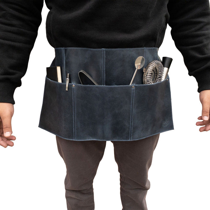 Detail view of the black Hide & Drink Barista Leather Waist Apron, highlighting its riveted pockets and vintage appeal, made from full grain leather, crafted expertly in La Antigua Guatemala & Oaxaca Mexico.