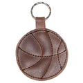 Close-up of the Basketball Keychain by Hide & Drink, highlighting its unique leather stitching and circular basketball shape. A stylish key ring for sports enthusiasts and a thoughtful gift for players, crafted from high-quality full grain leather.