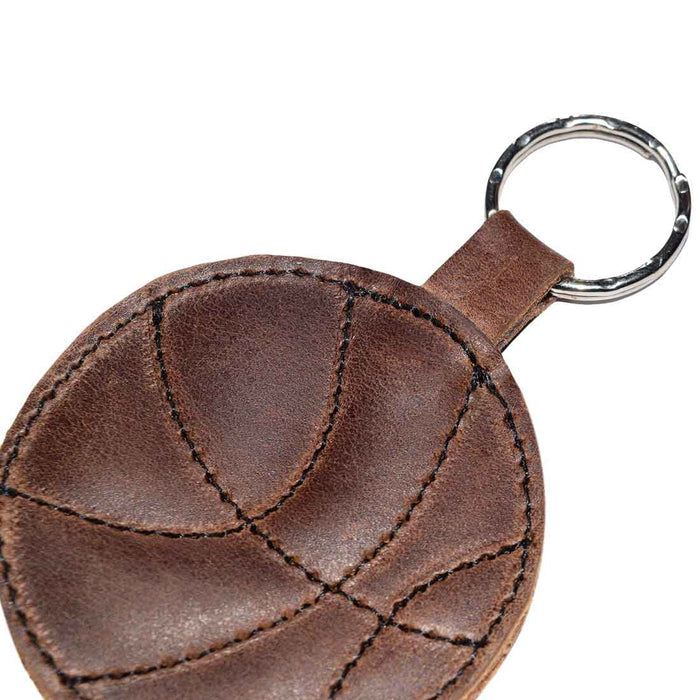 Top view of the Basketball Keychain by Hide & Drink, showcasing its leather texture and craftsmanship. An essential accessory for sports fans and a perfect gift for players, made from durable full grain leather in small batch production.