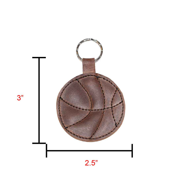 Dimensions of the Basketball Keychain by Hide & Drink displayed next to a ruler, illustrating its compact size. A perfect key ring for sports enthusiasts, crafted from full grain leather, ideal as a gift for players and handmade in La Antigua Guatemala & Oaxaca Mexico.