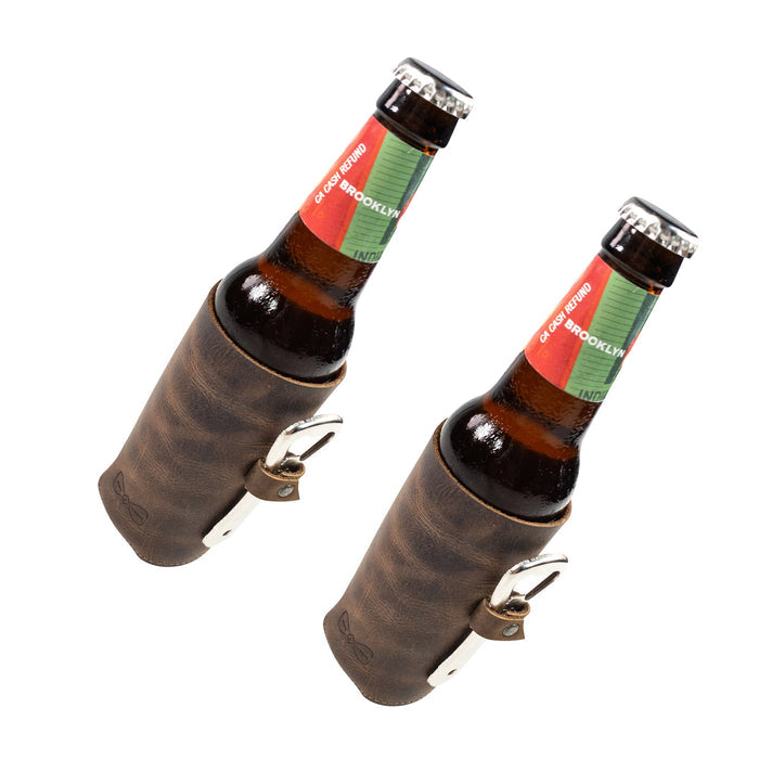Hide & Groom Beer Bottle Sleeve Set of 2 elegantly designed for standard bottles, showcasing the practical bottle opener slot and collapsible feature. These handcrafted covers are made from full grain leather in La Antigua Guatemala.