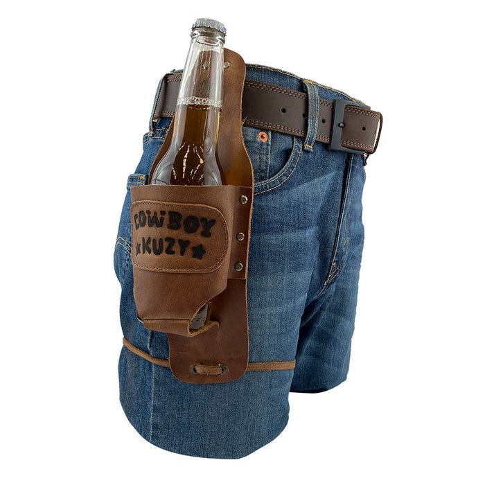 Beer Holster Stitched Designs by Hide & Drink displayed with a bottle inserted, attached to a belt, demonstrating its handsfree functionality. This Beer Holster for Cowboy is perfect for events, made from rich Full Grain Leather, suitable for both men and women, and showcases the small batch production quality with hand cut and hand sewn precision, artisan fire branding, handmade in La Antigua Guatemala & Oaxaca Mexico.