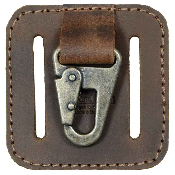 Detailed view of the clasp of the Belt Key Holder by Hide & Drink, featuring a vintage keychain design with rustic charm. This essential accessory is crafted from premium full grain leather, embodying small batch production and handmade artistry from La Antigua Guatemala & Oaxaca Mexico.