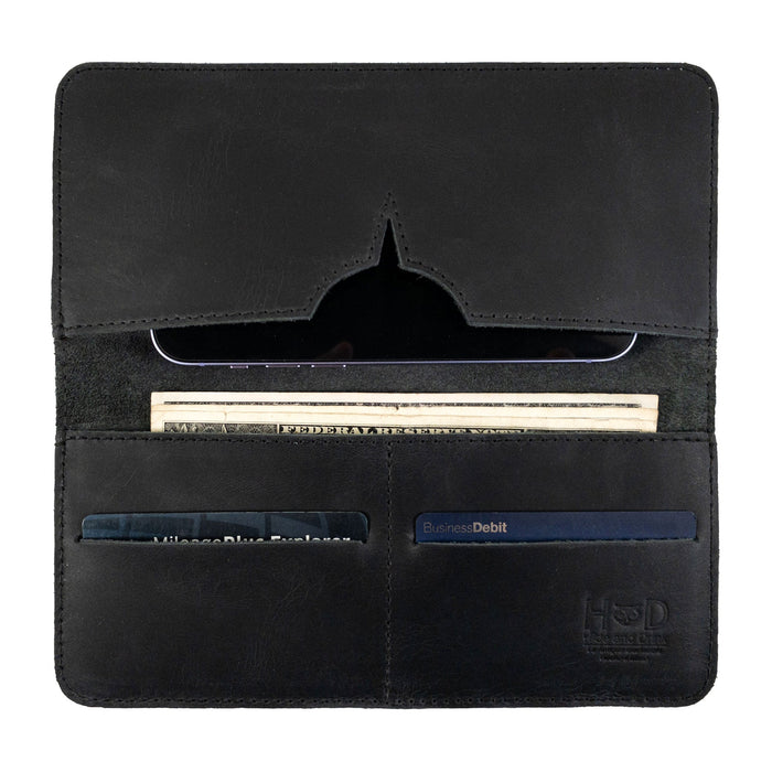 Detailed interior view of the black bifold wallet for cellphone by Hide & Drink, showcasing card and cash slots. This functional Bifold Wallet for Cellphone combines practicality with elegance in Full Grain Leather. Experience the high-quality artisan design made through small batch production in La Antigua Guatemala & Oaxaca Mexico.