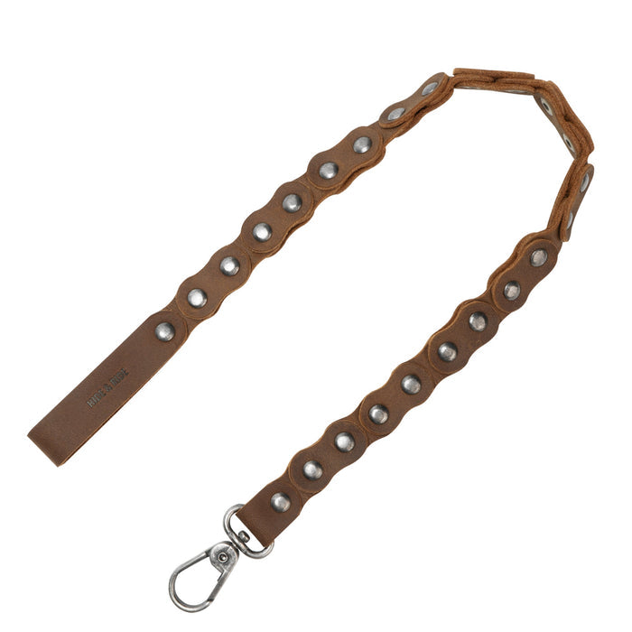 Showcasing the Biker Chain by Hide & Ride, this tough trouser chain is designed for bikers. Crafted from full grain leather, it makes an excellent wallet chain or jeans pocket chain, perfect as a belt accessory. This handmade product reflects StockyardX's commitment to small batch production, featuring hand cut and hand sewn details for durability, all while being fire branded by artisans in La Antigua Guatemala & Oaxaca Mexico.
