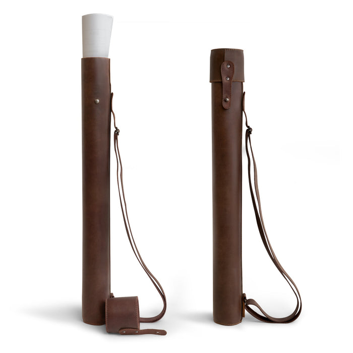 Hide & Drink's Blueprint Tube (A2 Paper Size), an Artisan-made document storage tube crafted from full grain leather, featuring an adjustable strap. Perfect for holding architectural drawings, this Blueprint Tube combines functionality with style, showcasing StockyardX's small batch production techniques and the handmade quality from La Antigua Guatemala & Oaxaca Mexico.