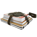 Hide & Drink Book Strap Carrier used with notebooks, showcasing its ergonomic design. This Full Grain Leather accessory is artisan-crafted in La Antigua Guatemala and is perfect for readers on the go.