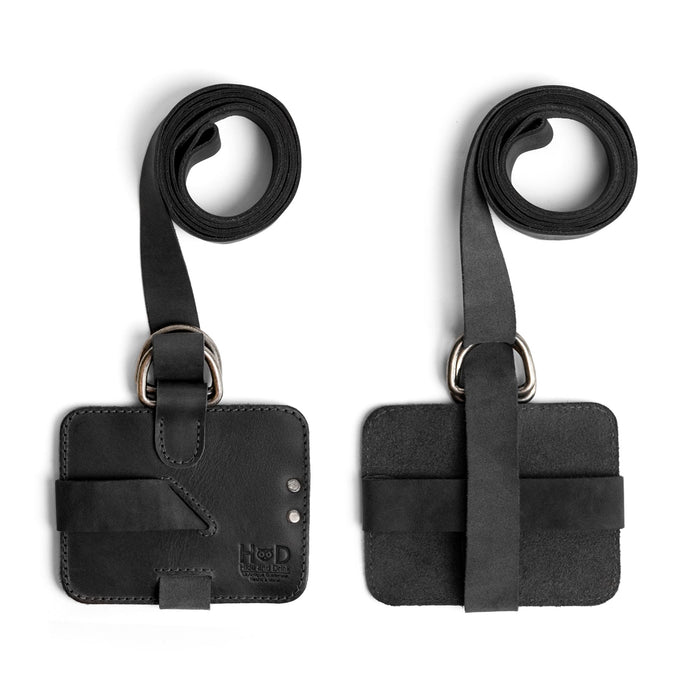 Close-up image of the Hide & Drink Book Strap Carrier, emphasizing the unique textures of the Full Grain Leather. A great accessory for readers, this handmade product hails from La Antigua Guatemala, merging practicality with artisan craftsmanship.