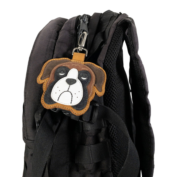Boxer Face Charm by TACO DOG displayed on a black backpack clip, made from durable Full Grain Leather. A charming artisan accessory made through small batch production, hand cut and hand sewn methods to highlight craftsmanship. Handmade in La Antigua Guatemala & Oaxaca Mexico.