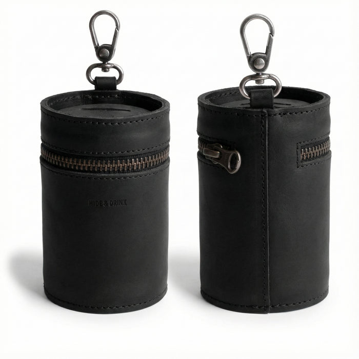 Front and back view of the Bucket Coin Release by Hide & Drink, a stylish piggy bank bucket made from full grain leather. This artisan zippered pouch serves as a cash organizer and coin case, showcasing small batch production techniques. Handmade in La Antigua Guatemala and Oaxaca Mexico, the money box features a durable clasp and is meticulously hand cut and hand sewn. Perfect for anyone looking for a functional yet elegant money-saving solution.