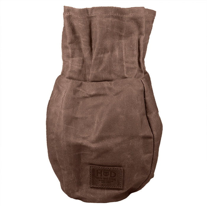 Bushcraft Tinder Bag by Hide & Drink, showcasing its unique Waxed Canvas structure. This water resistant outdoor pouch is perfect as a multipurpose camping accessory, highlighting small batch production with artisanal hand cut and hand sewn quality. Handmade in La Antigua Guatemala & Oaxaca Mexico.