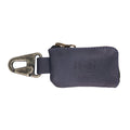 A detailed shot of the Car Key Holder by Hide & Drink featuring its rustic charm in full grain leather. This useful accessory holds cash, keys, and can organize headphone cables and flash drives, made with care in La Antigua Guatemala & Oaxaca Mexico.