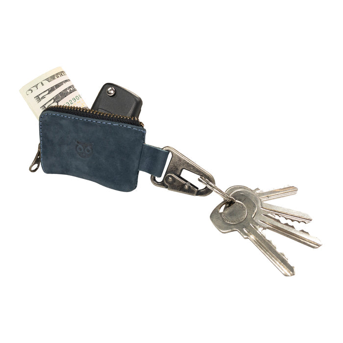 The Hide & Drink Car Key Holder displayed with keys and cash, showcasing its practicality with a nickel metal clasp and full grain leather design. Ideal as a zippered case for headphones, memory cards, and flash drives. Artisan handmade in La Antigua Guatemala & Oaxaca Mexico.
