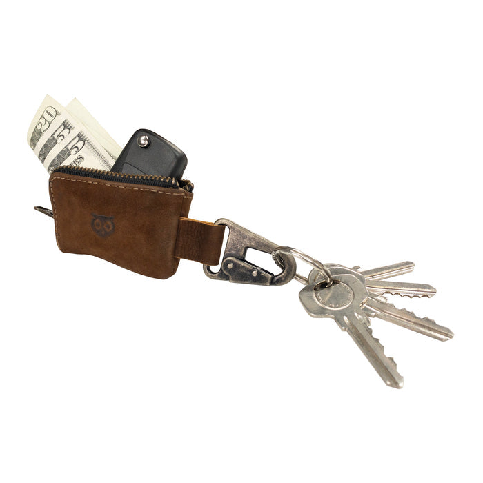 The Car Key Holder from Hide & Drink features a rustic leather storage that can hold cash and a car key fob, ideal for quick access. This Car Key Holder's design allows it to function as a cash zipper case with a durable nickel metal clasp, crafted from full grain leather. It's perfect for organizing headphone and charging cables, memory cards, and flash drives. Enjoy artisan quality with small batch production, hand cut, hand sewn details, handmade in La Antigua Guatemala & Oaxaca Mexico.