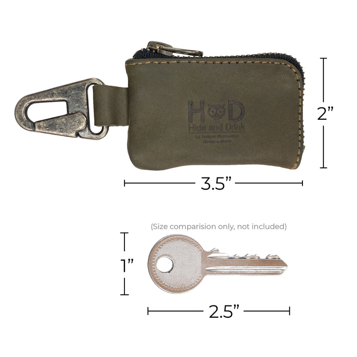 Hide & Drink Car Key Holder displayed with packaging, emphasizing its artisanal quality while showcasing its functionality for cash and small accessories like headphone cables, secured by a Nickel Metal Clasp. StockyardX, Small Batch Production, Hand Cut, Hand Sewn, Fire Branded, Artisan, Handmade in La Antigua Guatemala & Oaxaca Mexico.