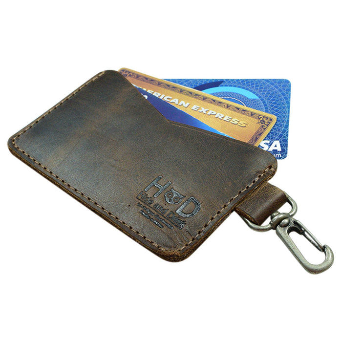 Front view of the Leather Card & Key Holder by Hide & Drink, designed to hold up to 4 cards. This versatile Keychain Organizer is made from Full Grain Leather and features a lobster clip. Its artisan craftsmanship shines through with every hand cut and hand sewn detail, embodying small batch production principles. Handmade in La Antigua Guatemala & Oaxaca Mexico.