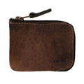 A stylish Card Pocket Wallet by Hide & Drink, featuring a compact design in full grain leather. This zippered card wallet for men and women serves as a coin pouch and money holder while keeping everything organized. Handmade in La Antigua Guatemala, it showcases small batch production, hand cut and hand sewn craftsmanship, with fire branded details.