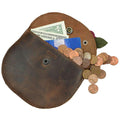 Interior view of the Card Wallet Rose Design by Hide & Drink displaying cash, coins, and a card, emphasizing its versatility as a wallet case and organizer. Made from durable full grain leather, this artisan piece is designed in La Antigua Guatemala & Oaxaca Mexico, ensuring quality with each hand sewn detail.