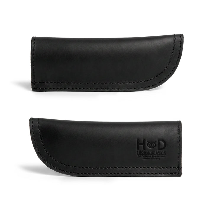Hide & Drink Cast Iron Panhandle Cover showcased in a stylish angle, highlighting its craftsmanship. This hot handle protector, designed for easy application to metal skillets, exemplifies full grain leather quality. Handmade in La Antigua Guatemala & Oaxaca Mexico, it’s perfect for adding flair while cooking.