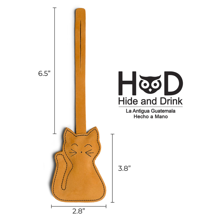 Hide & Drink Bag Charms illustrating dimensions for an adorable nose design. This charm for handbags serves as a purse charm for tote & backpacks made from high-quality full grain leather. Reflecting StockyardX's small batch production ethos, each piece showcases hand cut, hand sewn craftsmanship and fire branding, handmade in La Antigua Guatemala & Oaxaca Mexico.