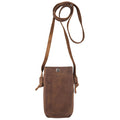 Hide & Drink Cell Phone Shoulder Bag presented in a rustic style, made of durable full grain leather. This phone bag features a soft exterior and a strap for easy carrying. Ideal as a shoulder bag or crossbody bag for cellphone use, it serves as a thoughtful travel accessory with handmade quality from artisans in La Antigua Guatemala & Oaxaca Mexico.