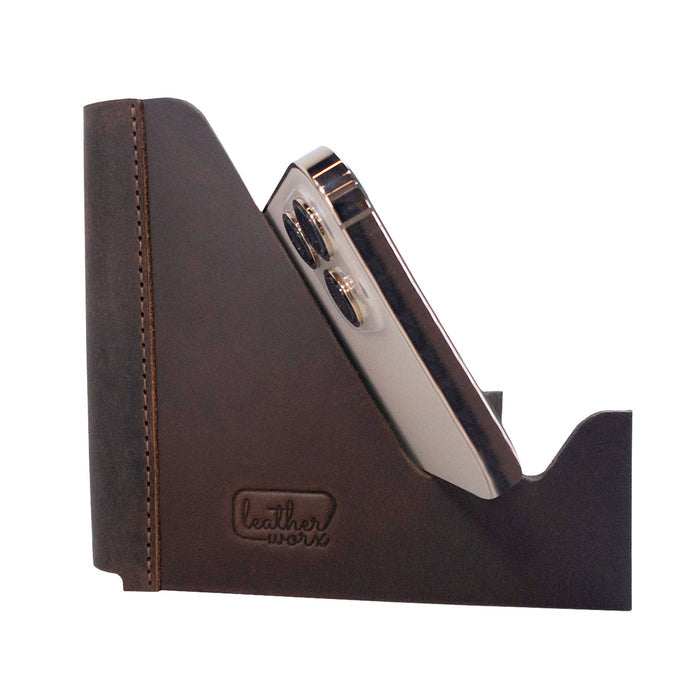 Leather Worx Cell Phone Stand for Desk, a rustic foldable design showcasing a smartphone securely placed, highlighting its role as a stylish Cell Phone Holder and office accessory made from full grain leather. Perfect for any desktop, this small batch production item is hand cut, hand sewn, and fire branded, proudly made by artisans in La Antigua Guatemala & Oaxaca Mexico.