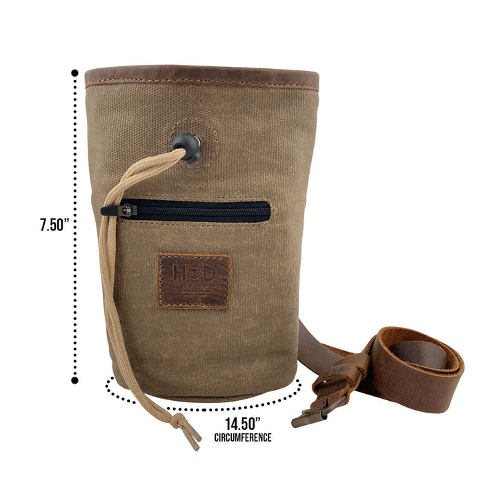 Hide & Drink Chalk Bag dimensions displayed, highlighting its Waxed Canvas and Full Grain Leather. A perfect companion for rock climbers and gymnasts, this artisan bag is handmade and includes a zippered pocket. Produced in La Antigua Guatemala & Oaxaca Mexico.