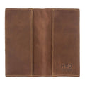 Checkbook Leather Cover by Hide & Drink in a rich brown shade, designed to function as a minimalist organizer for standard checkbooks. This artisan product, handmade from full grain leather, highlights craftsmanship from La Antigua Guatemala and Oaxaca Mexico, emphasizing small batch production.