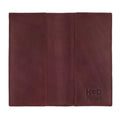 Checkbook Leather Cover by Hide & Drink showcasing its vibrant design as a minimalist organizer for standard checkbooks. This artisan piece, made from full grain leather, is handmade in La Antigua Guatemala and Oaxaca Mexico, emphasizing the tradition of small batch production.