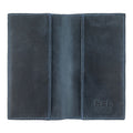 Open design of the brown Checkbook Leather Cover by Hide & Drink, showcases its function as a minimalist organizer for standard checkbooks. Made from high-quality full grain leather, this handmade item reflects artisan craftsmanship from La Antigua Guatemala and Oaxaca Mexico, promoting small batch production.