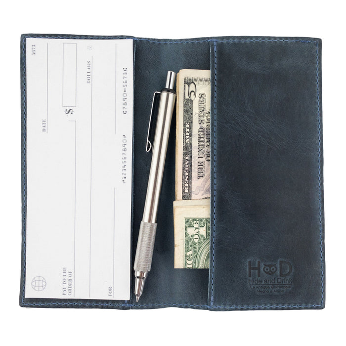 Clean layout of the brown Checkbook Leather Cover by Hide & Drink, positioned as a minimalist organizer for standard checkbooks. This artisan piece, handcrafted from full grain leather, comes from small batch production practices in La Antigua Guatemala and Oaxaca Mexico.