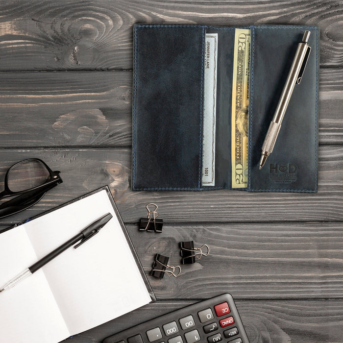 Checkbook Leather Cover by Hide & Drink in dark brown, designed to function as a minimalist organizer for standard checkbooks. This artisan item is handmade from full grain leather, reflecting craftsmanship from La Antigua Guatemala and Oaxaca Mexico, showcasing small batch production.
