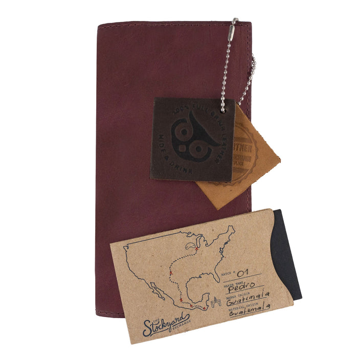 Detailed view of the Checkbook Leather Cover by Hide & Drink, featuring its elegant design as a minimalist organizer for standard checkbooks. This artisan product is handmade from full grain leather in La Antigua Guatemala and Oaxaca Mexico, emphasizing small batch production.