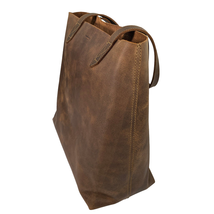 Back view of Heather's Classic Tote Bag made from exquisite full grain leather, showcasing its robust construction. This vintage style purse is perfect for stylish travel and shopping adventures, created with care in La Antigua Guatemala.
