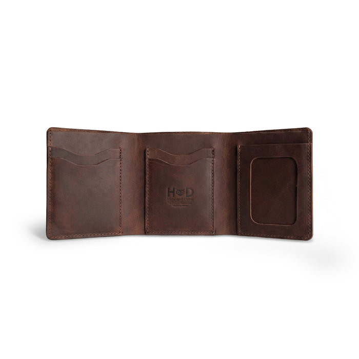 Inside of the Classic Trifold Wallet by Hide & Drink, featuring soft Full Grain Leather with a card slot. This wallet exemplifies Hand Cut and Hand Sewn craftsmanship from skilled artisans in La Antigua Guatemala & Oaxaca, Mexico.
