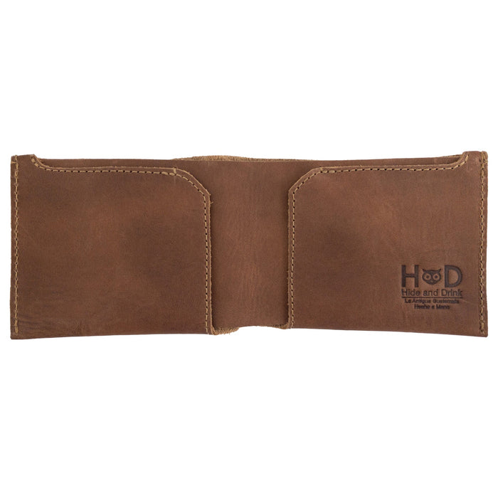 Close-up of the brown Hide & Drink Classic Wallet highlighting its quality materials and hand-stitched finish for a vintage look. Classic Wallet, Card Organizer, Money Holder, Vintage Pocket, Travel Accessories, Full Grain Leather, StockyardX, Small Batch Production, Hand Cut, Hand Sewn, Fire Branded, Artisan, Handmade in La Antigua Guatemala & Oaxaca Mexico.