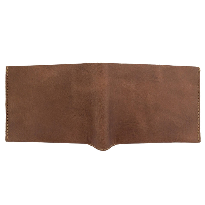 Angled view of the brown Hide & Drink Classic Wallet demonstrating its compact and stylish design ideal for personal use. Classic Wallet, Card Organizer, Money Holder, Vintage Pocket, Travel Accessories, Full Grain Leather, StockyardX, Small Batch Production, Hand Cut, Hand Sewn, Fire Branded, Artisan, Handmade in La Antigua Guatemala & Oaxaca Mexico.