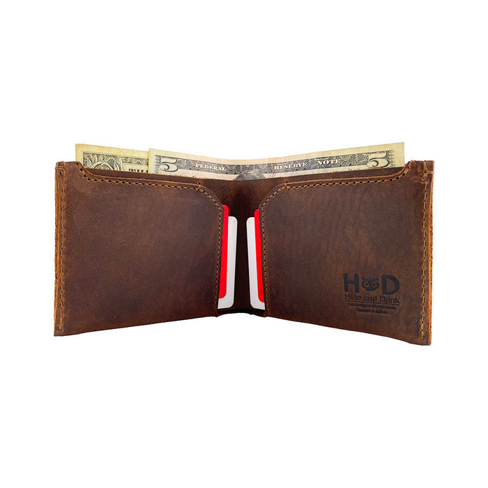 Inside view of the Hide & Drink Classic Wallet with cards and cash, highlighting its practical use as a card organizer and money holder. Classic Wallet, Card Organizer, Money Holder, Vintage Pocket, Travel Accessories, Full Grain Leather, StockyardX, Small Batch Production, Hand Cut, Hand Sewn, Fire Branded, Artisan, Handmade in La Antigua Guatemala & Oaxaca Mexico.